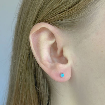 Sterling Silver Rhodium Plated Cyan Synthetic Opal Studs